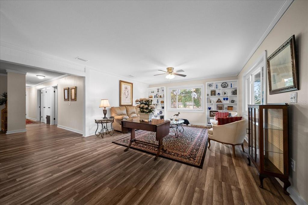 7380 Southwest 86th Lane Ocala, FL 34476 - Photo 5 of 50 a living room with furniture and a wooden floor