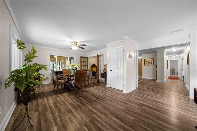 a very nice looking room with many windows and furniture