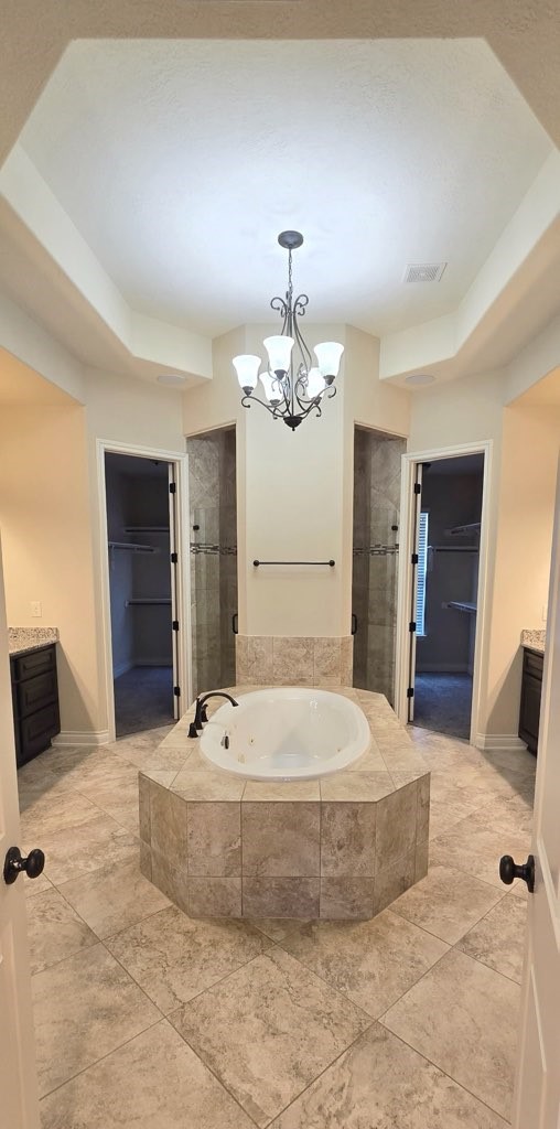 127 Bridgewater Onalaska, TX 77360 - Photo 16 of 34 a bathroom with a tub sink and mirror