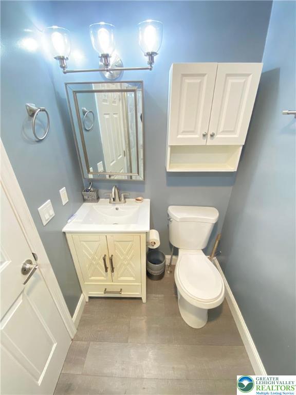 4571 Newburg Road Nazareth, PA 18064 - Photo 16 of 29 a bathroom with a toilet sink and mirror