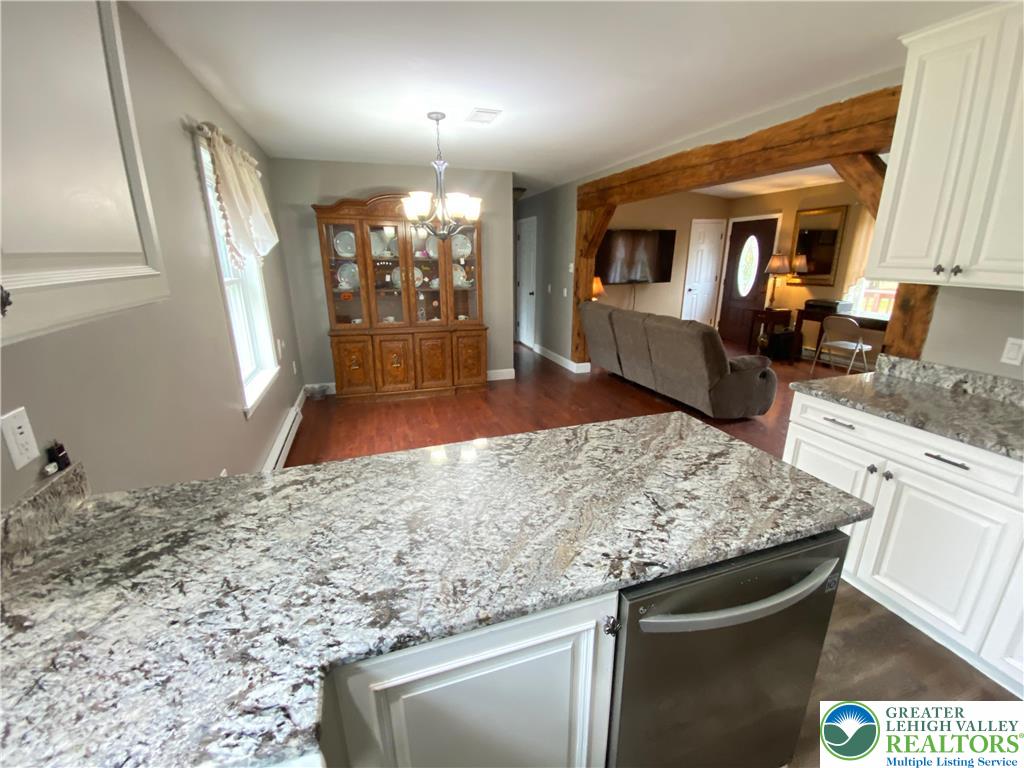 4571 Newburg Road Nazareth, PA 18064 - Photo 6 of 29 a view of a kitchen with granite countertop a sink stove and refrigerator