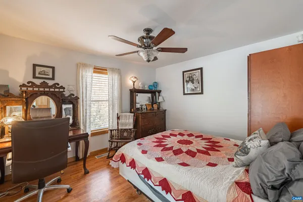 a kitchen with granite countertop a sink appliances dining table and chairs