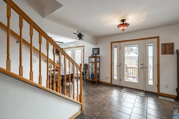 a view of a a dining room with furniture window and outside view