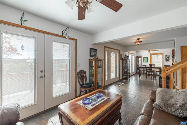 a bedroom with a bed a couch and dresser