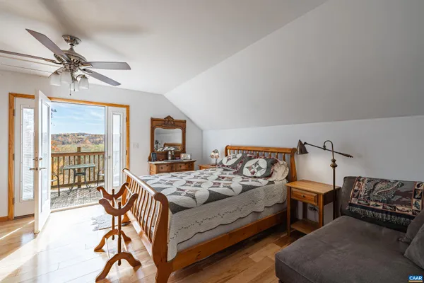 a living room with furniture a table and chairs