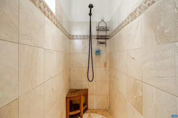 a view of a chairs and table in the balcony