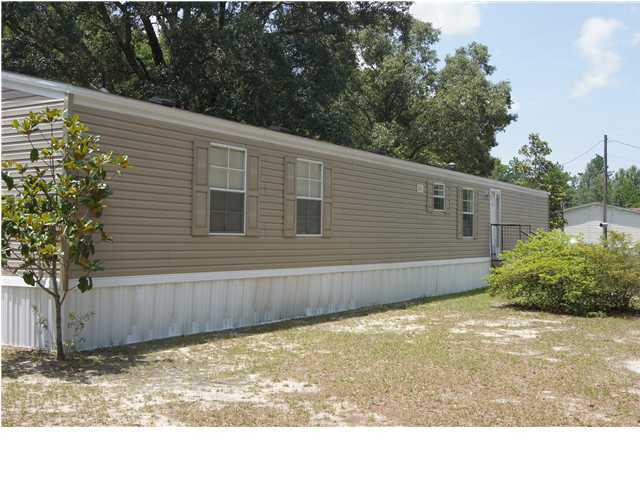 4305 Rebecca Road Crestview, FL 32539 - Photo 1 of 20 a view of a backyard of the house