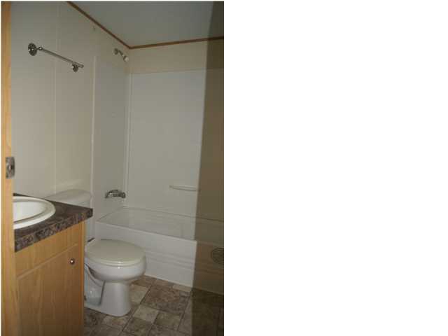 4305 Rebecca Road Crestview, FL 32539 - Photo 15 of 20 a bathroom with a toilet and a shower