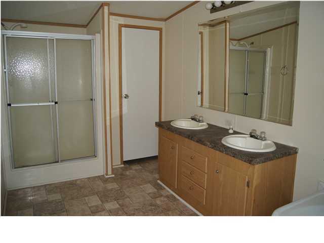 4305 Rebecca Road Crestview, FL 32539 - Photo 9 of 20 a bathroom with a sink a toilet and shower