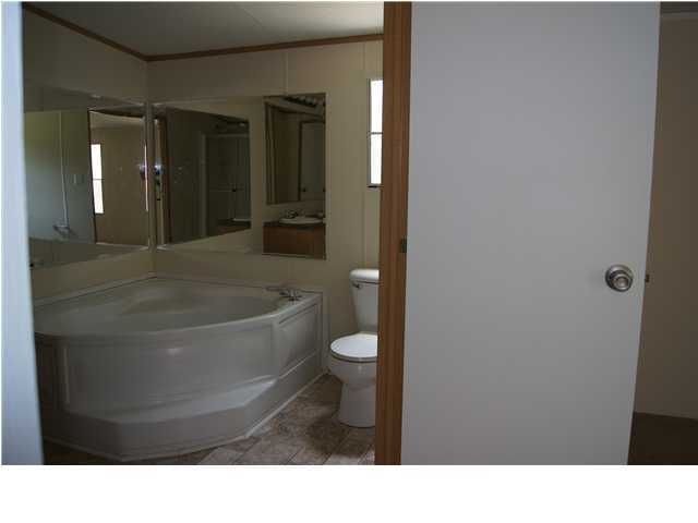 4305 Rebecca Road Crestview, FL 32539 - Photo 10 of 20 a bathroom with a toilet and a bathtub
