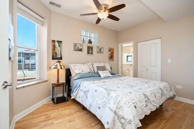 a bedroom with bed and window