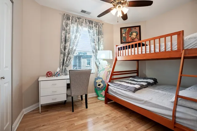 a bedroom with furniture and a window