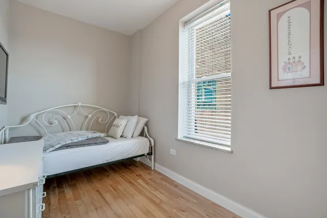 a living room with a couch and a window