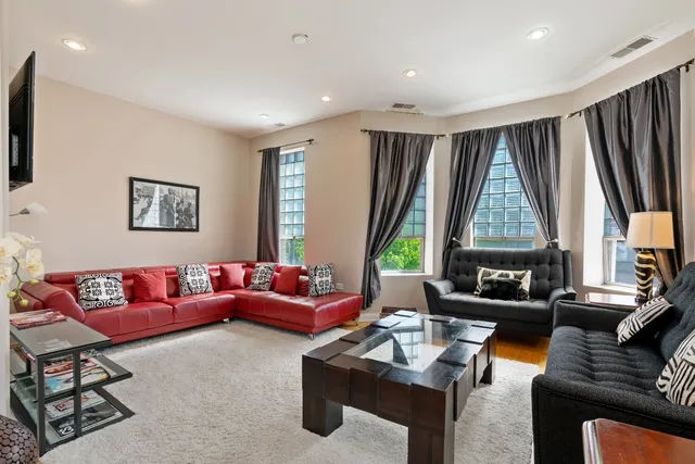a living room with furniture and a large window