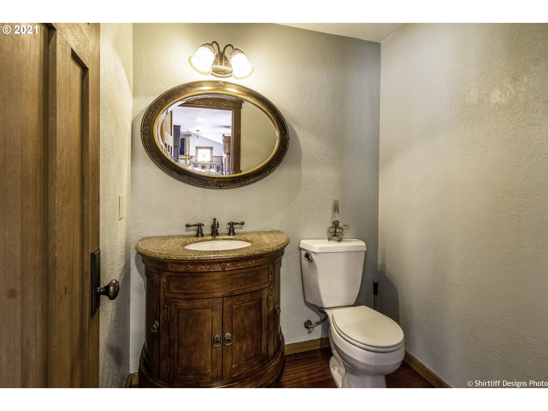 37170 Camp Creek Road Springfield, OR 97478 - Photo 25 of 29 a bathroom with a toilet a sink and a mirror