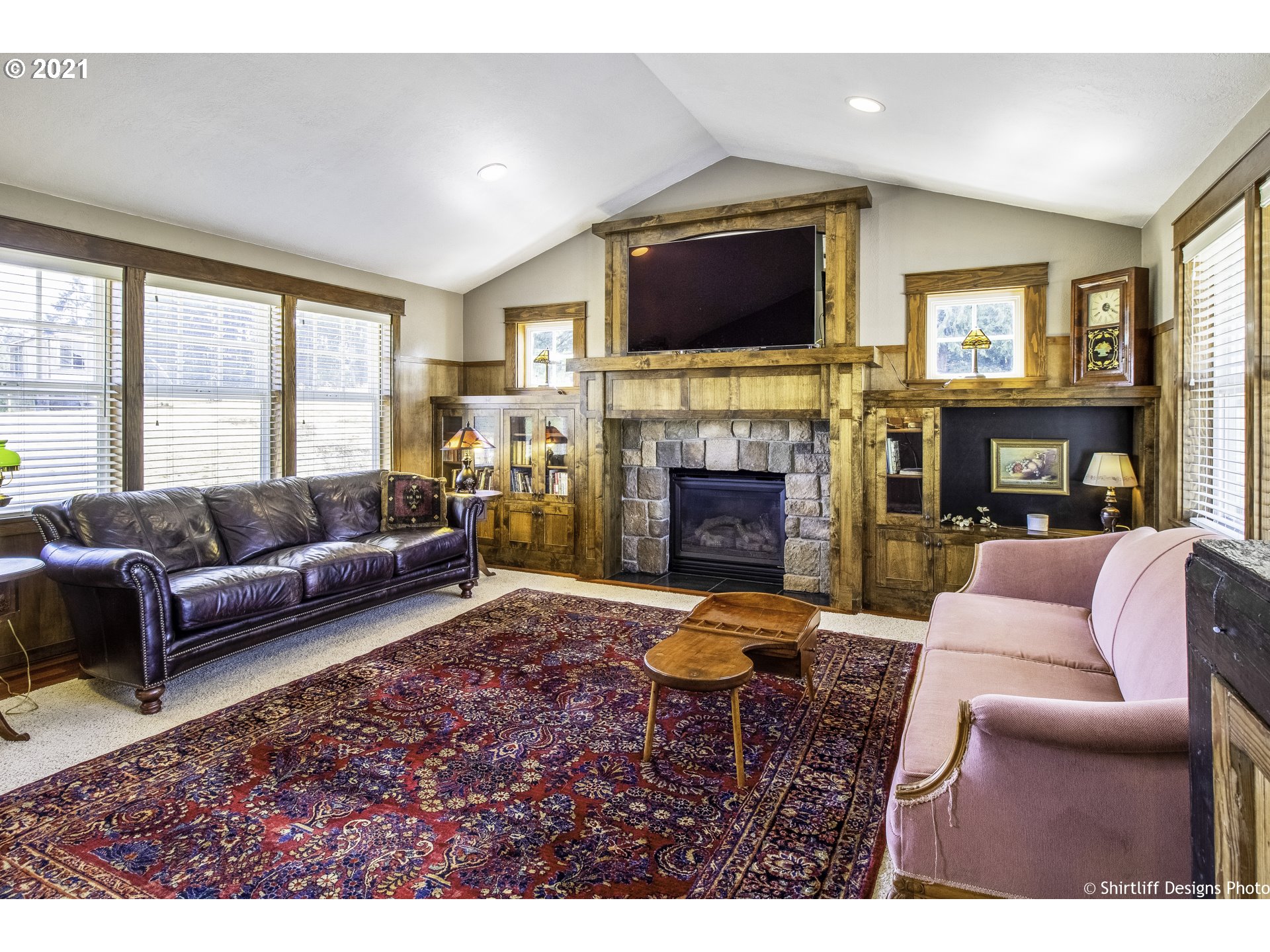 37170 Camp Creek Road Springfield, OR 97478 - Photo 5 of 29 a living room with furniture a fireplace and a flat screen tv