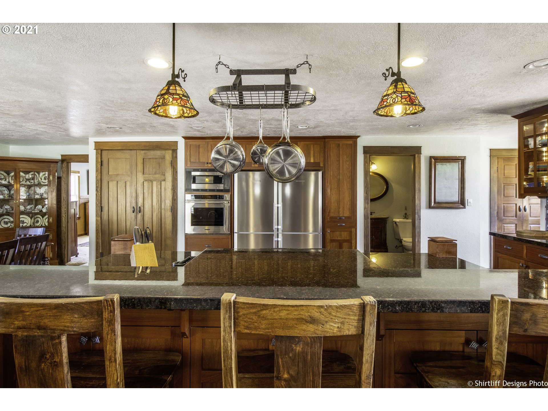37170 Camp Creek Road Springfield, OR 97478 - Photo 7 of 29 a view of a kitchen with a sink and chandelier
