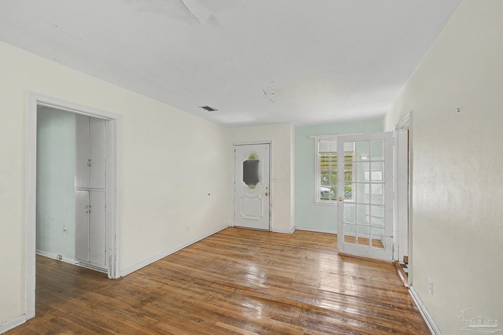 333 Gibbs Road Pensacola, FL 32507 - Photo 3 of 34 a view of empty room with wooden floor
