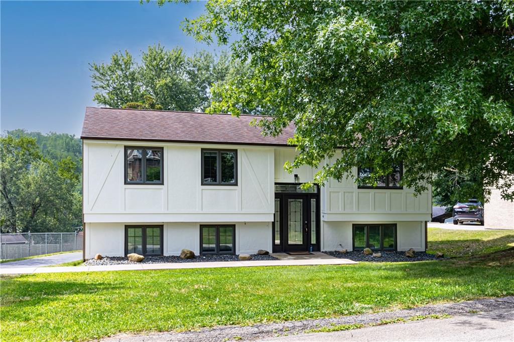 230 Dodd Drive Washington, PA 15301 - Photo 48 of 49 a front view of a house with a garden and trees