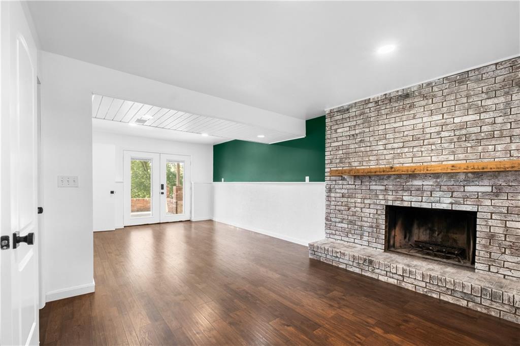 230 Dodd Drive Washington, PA 15301 - Photo 7 of 49 a view of an empty room with wooden floor and a fireplace