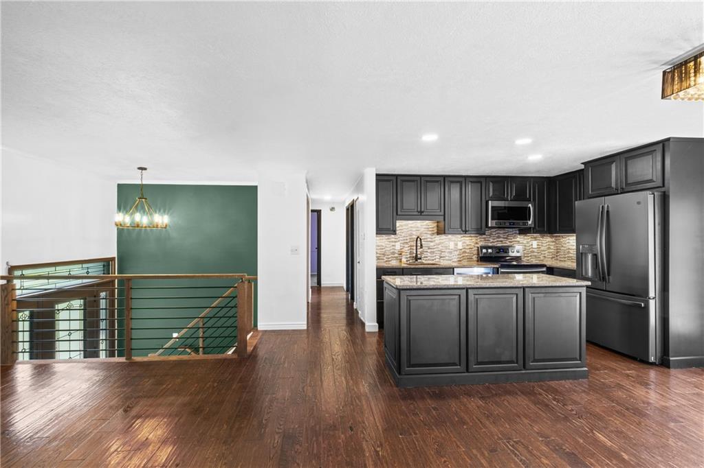230 Dodd Drive Washington, PA 15301 - Photo 8 of 49 a kitchen with stainless steel appliances granite countertop a refrigerator and a sink