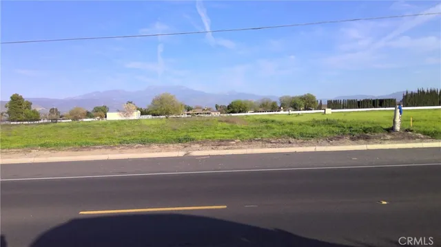 a view of a street with a building in the background