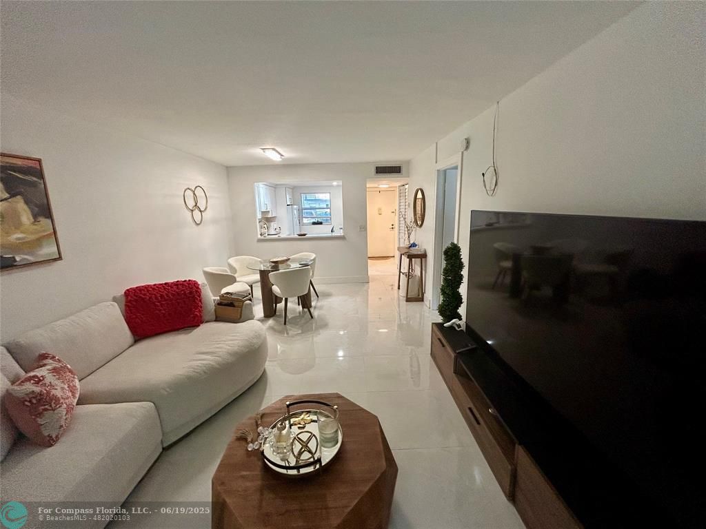 3060 Holiday Springs Boulevard, Unit 102 Margate, FL 33063 - Photo 11 of 12 a living room with furniture and a couch