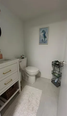 a bathroom with a toilet and a sink
