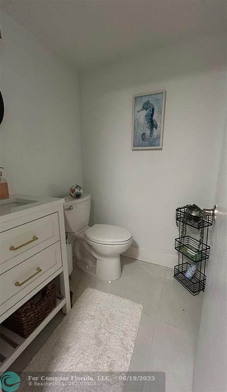 3060 Holiday Springs Boulevard, Unit 102 Margate, FL 33063 - Photo 5 of 12 a bathroom with a toilet and a sink