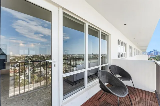 a balcony with chairs