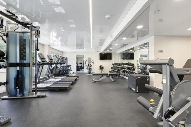 a view of a living room with gym equipment