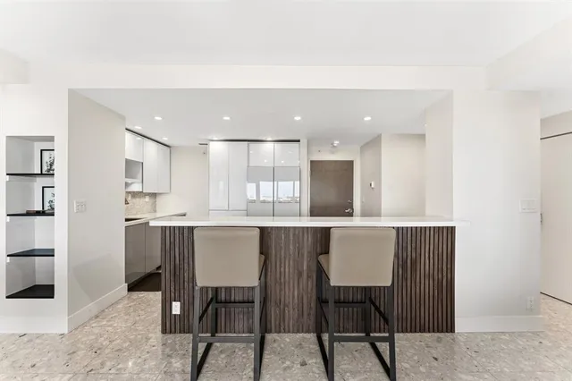 a kitchen with a table and chairs in it