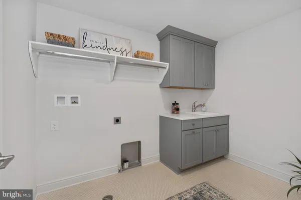 a utility room with cabinets