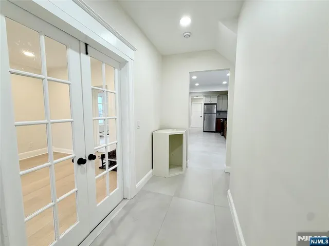 a view of a hallway with a living room