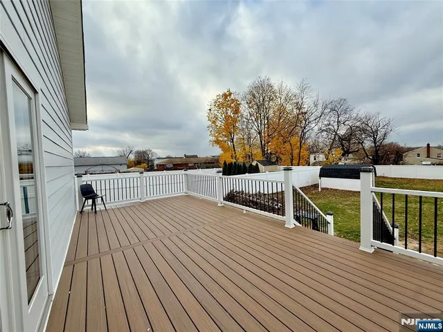 a view of balcony with deck and wooden floor