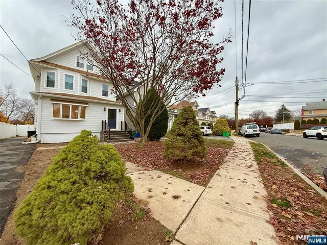 a view of a street with cars on road