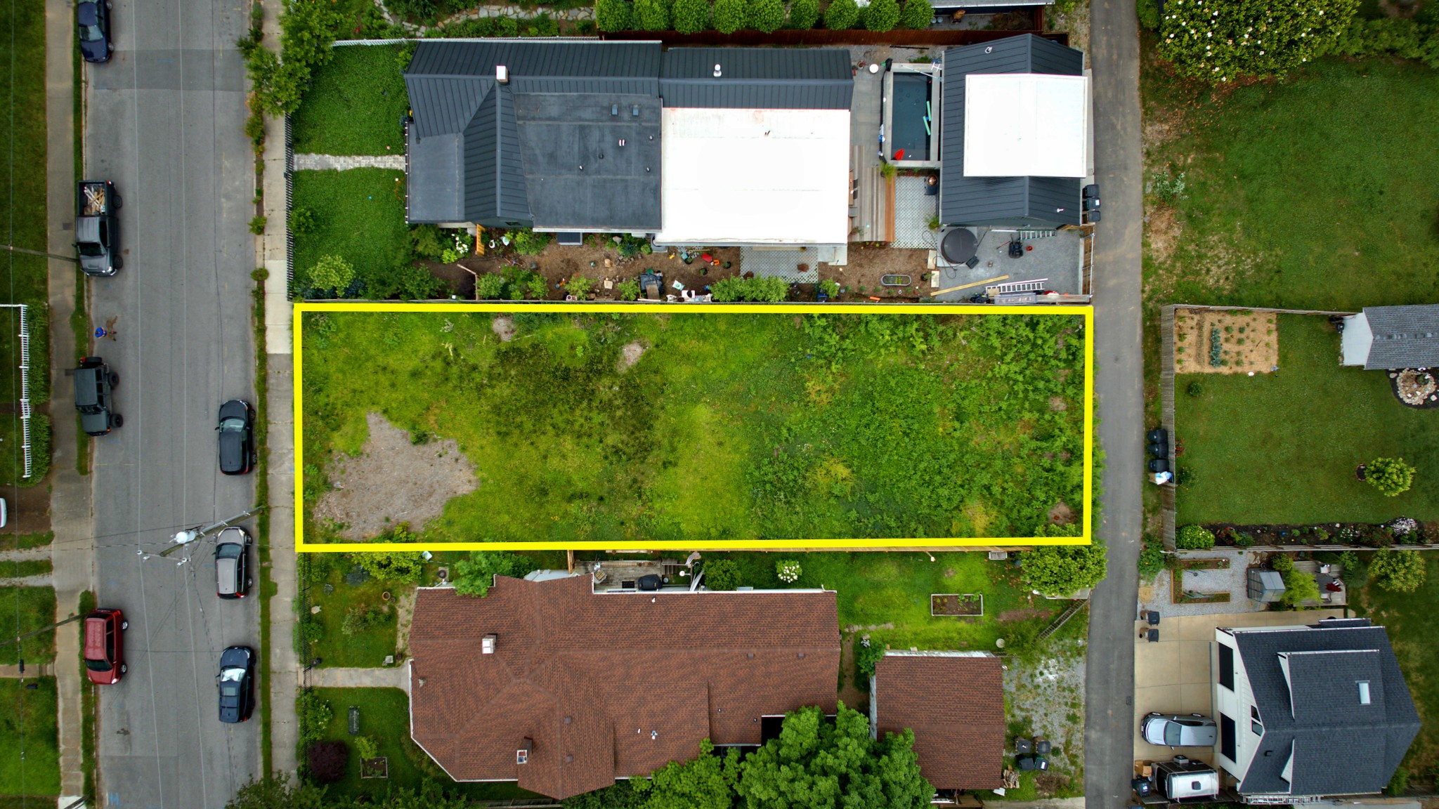 aerial view of a house with a garden and yard