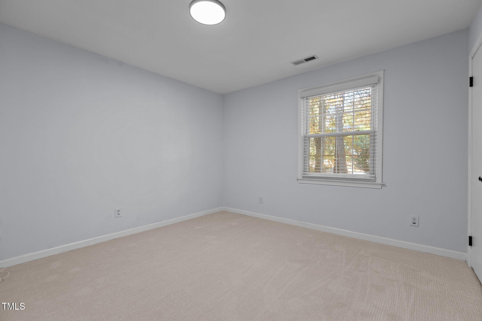 4113 Windsor Place Raleigh, NC 27609 - Photo 54 of 60 an empty room with a window