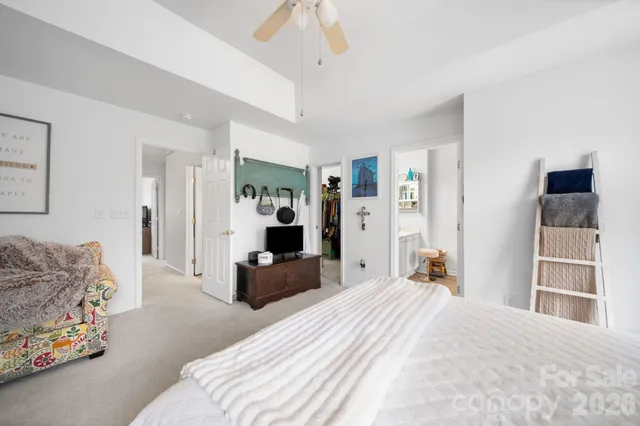 a bedroom with a bed and a couch