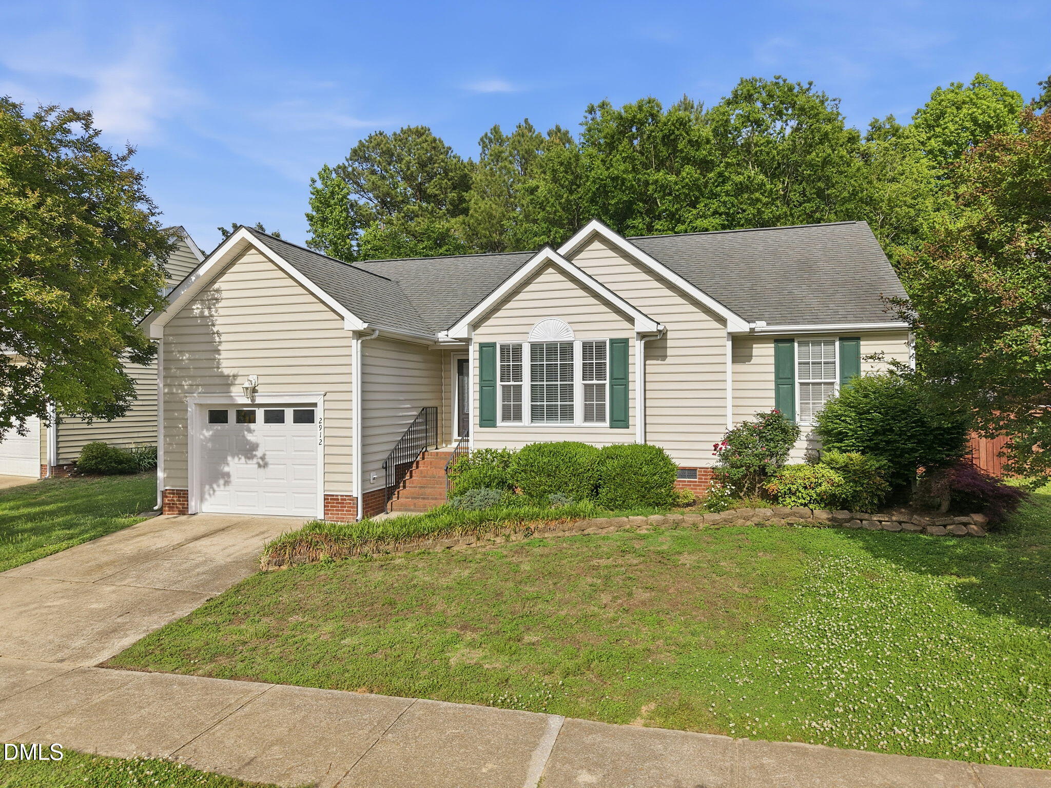 2912 Sedgefield Pines Lane Raleigh, NC 27604 - Photo 1 of 45 a front view of a house with a garden and yard