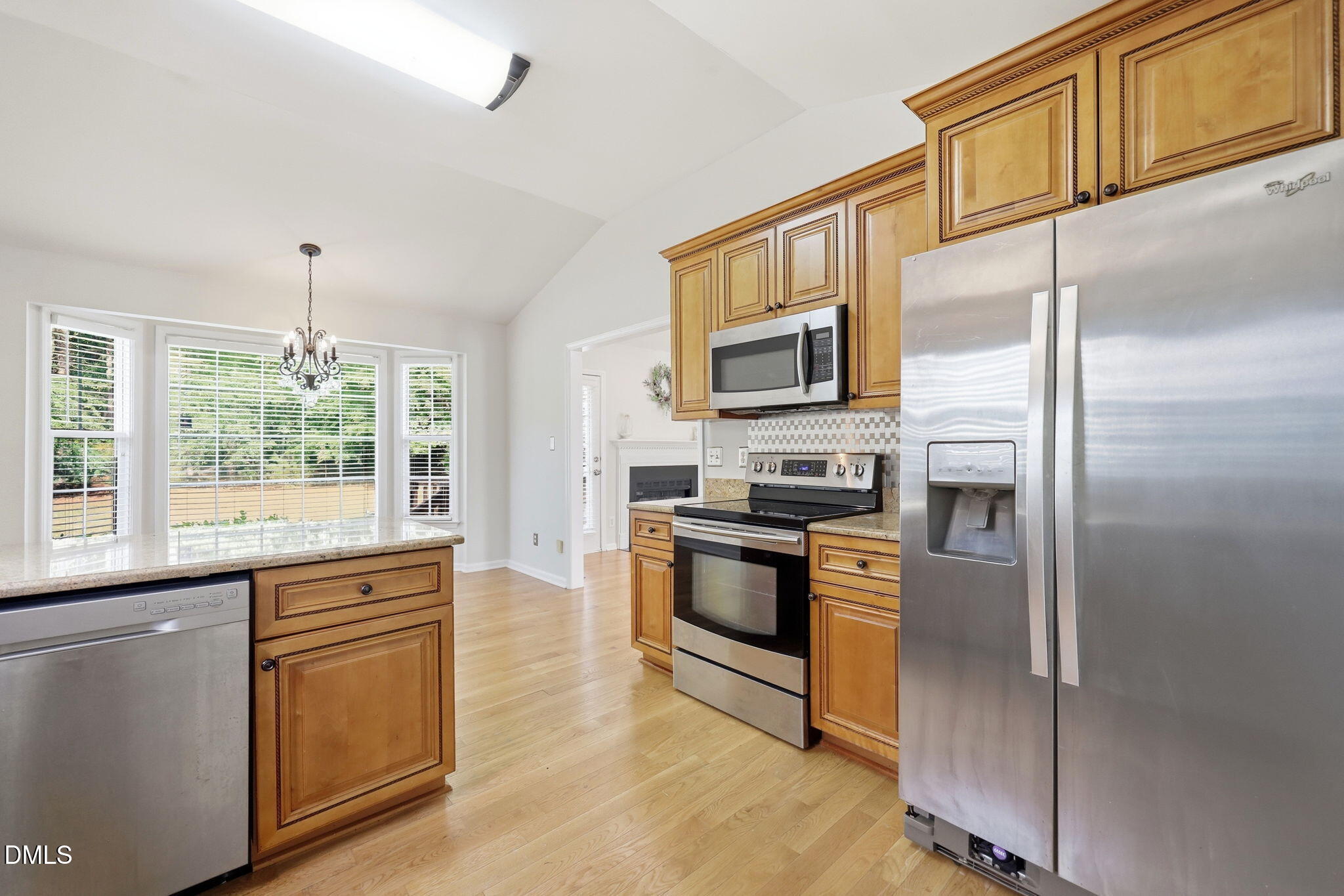 2912 Sedgefield Pines Lane Raleigh, NC 27604 - Photo 15 of 45 a kitchen with stainless steel appliances granite countertop a refrigerator stove microwave and sink