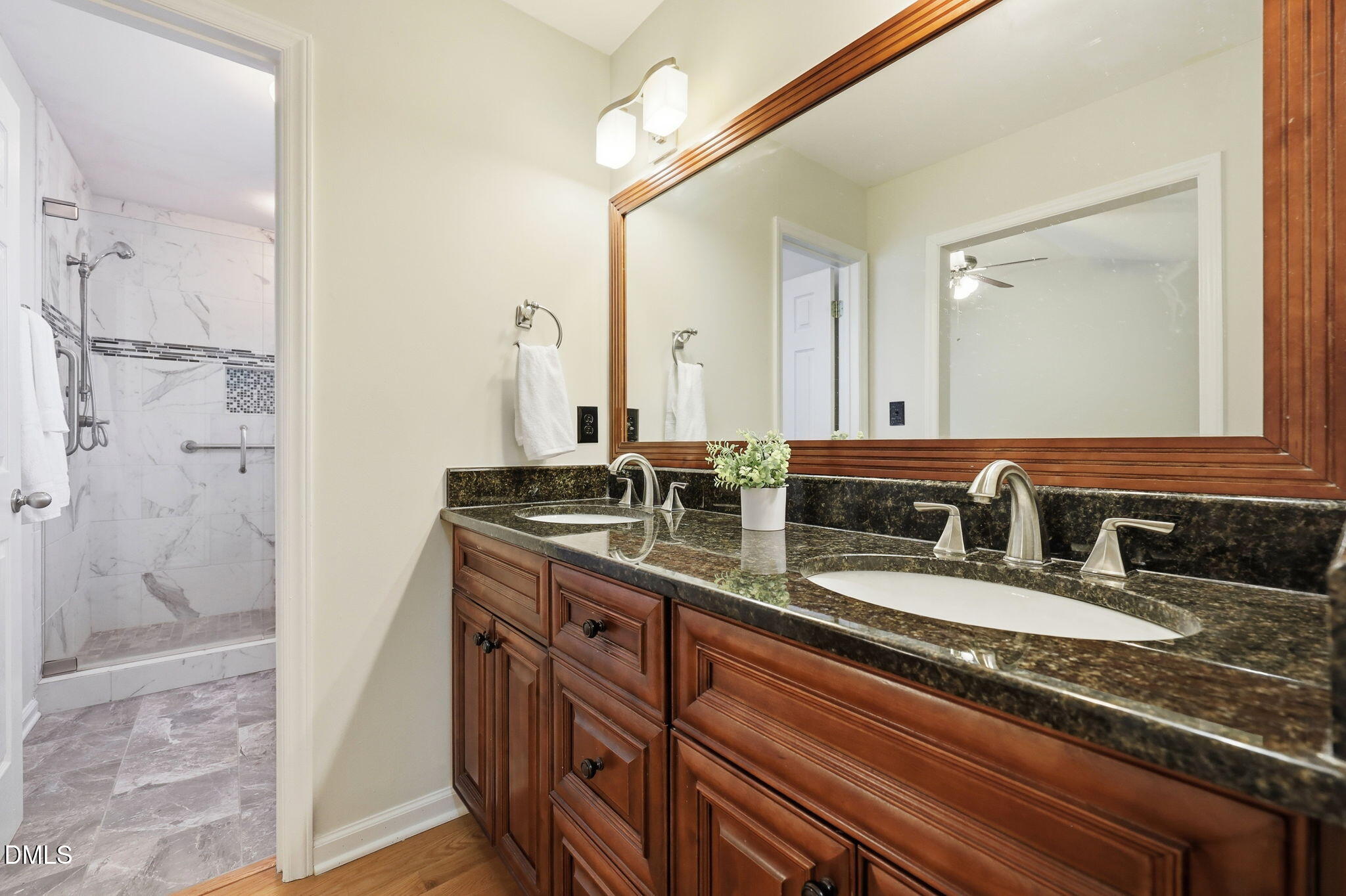 2912 Sedgefield Pines Lane Raleigh, NC 27604 - Photo 23 of 45 a bathroom with a granite countertop double vanity sink and shower