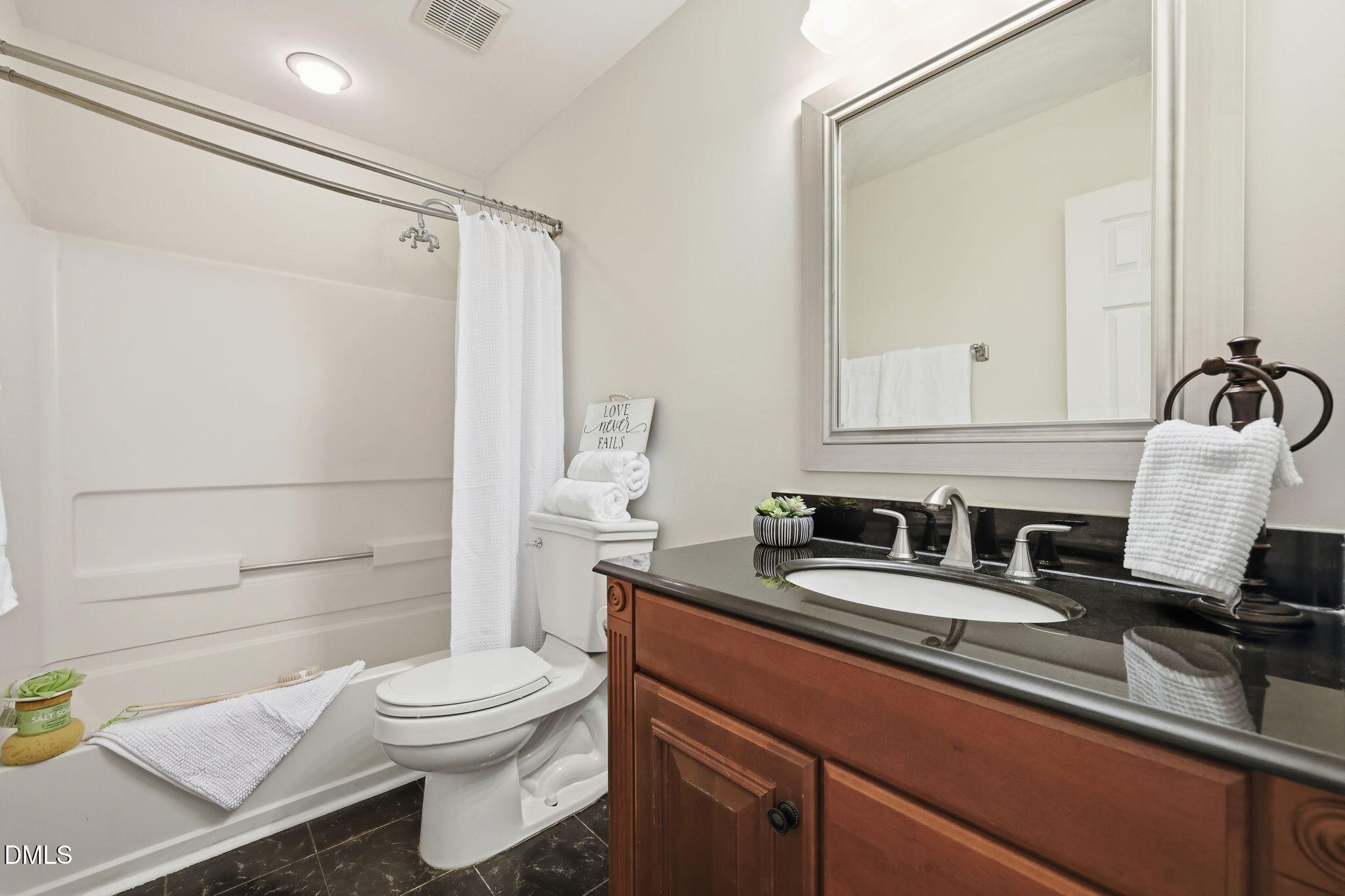 2912 Sedgefield Pines Lane Raleigh, NC 27604 - Photo 31 of 45 a bathroom with a sink a toilet and shower