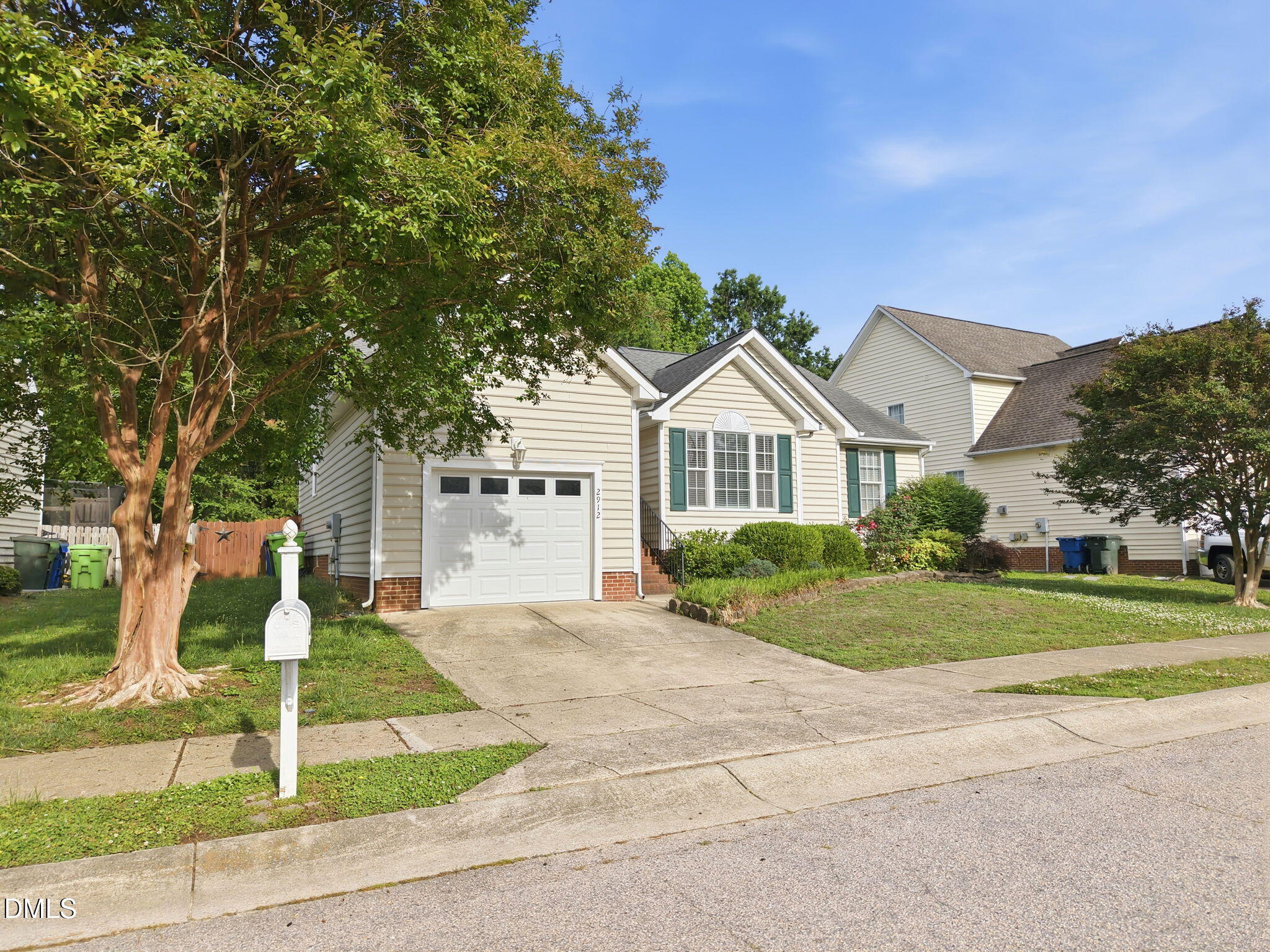 2912 Sedgefield Pines Lane Raleigh, NC 27604 - Photo 5 of 45 a front view of a house with a yard and garage
