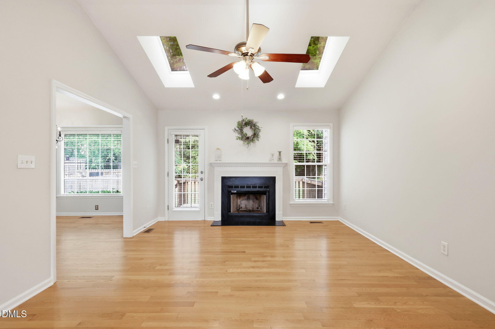 2912 Sedgefield Pines Lane Raleigh, NC 27604 - Photo 6 of 45 a view of an empty room with a fireplace