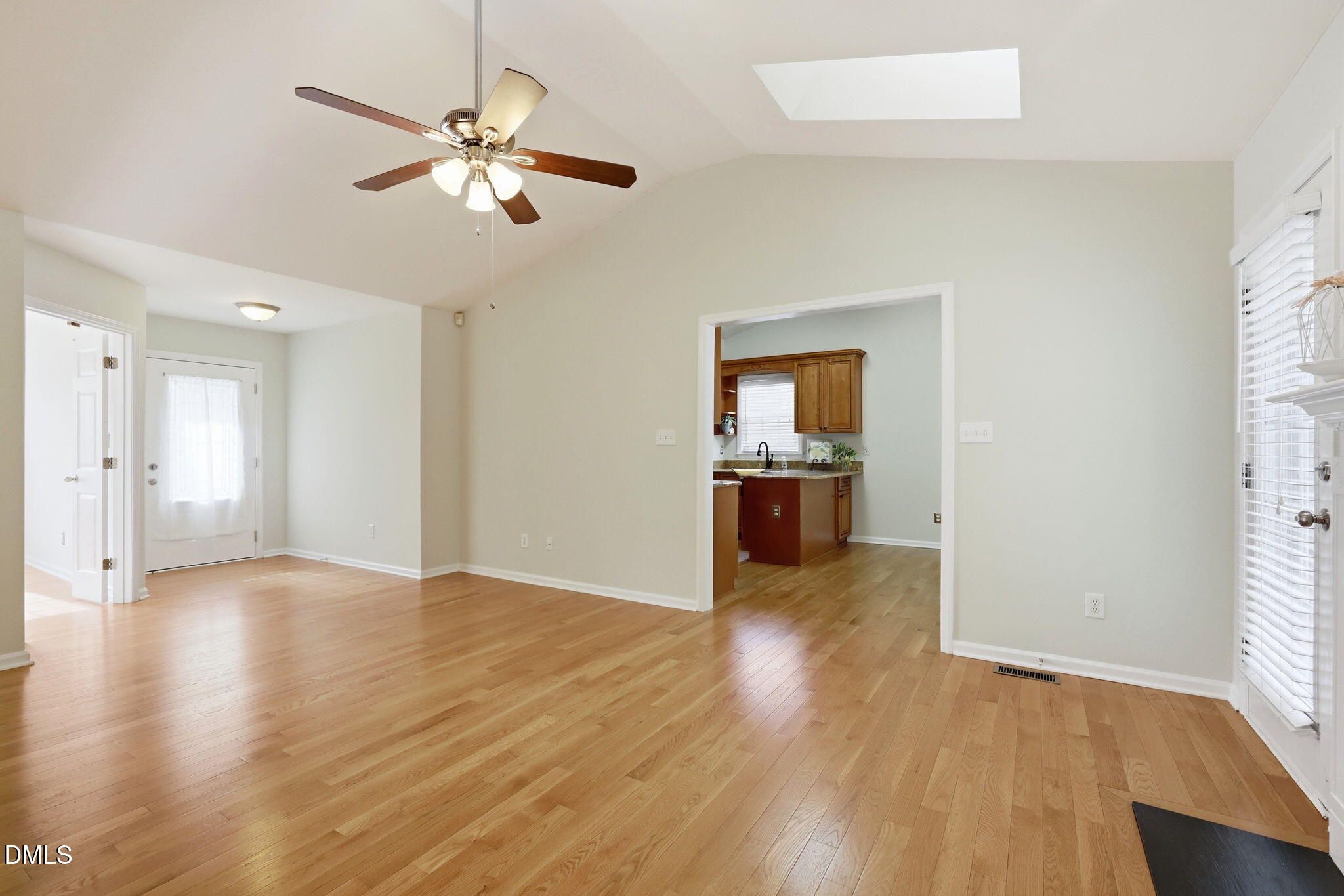 2912 Sedgefield Pines Lane Raleigh, NC 27604 - Photo 9 of 45 a view of an empty room with window and wooden floor
