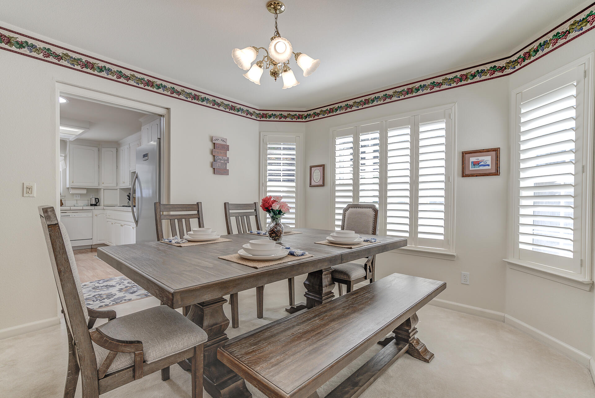 8303 Amberwoods Place Shingletown, CA 96088 - Photo 14 of 58 a view of a dining room with furniture window and wooden floor