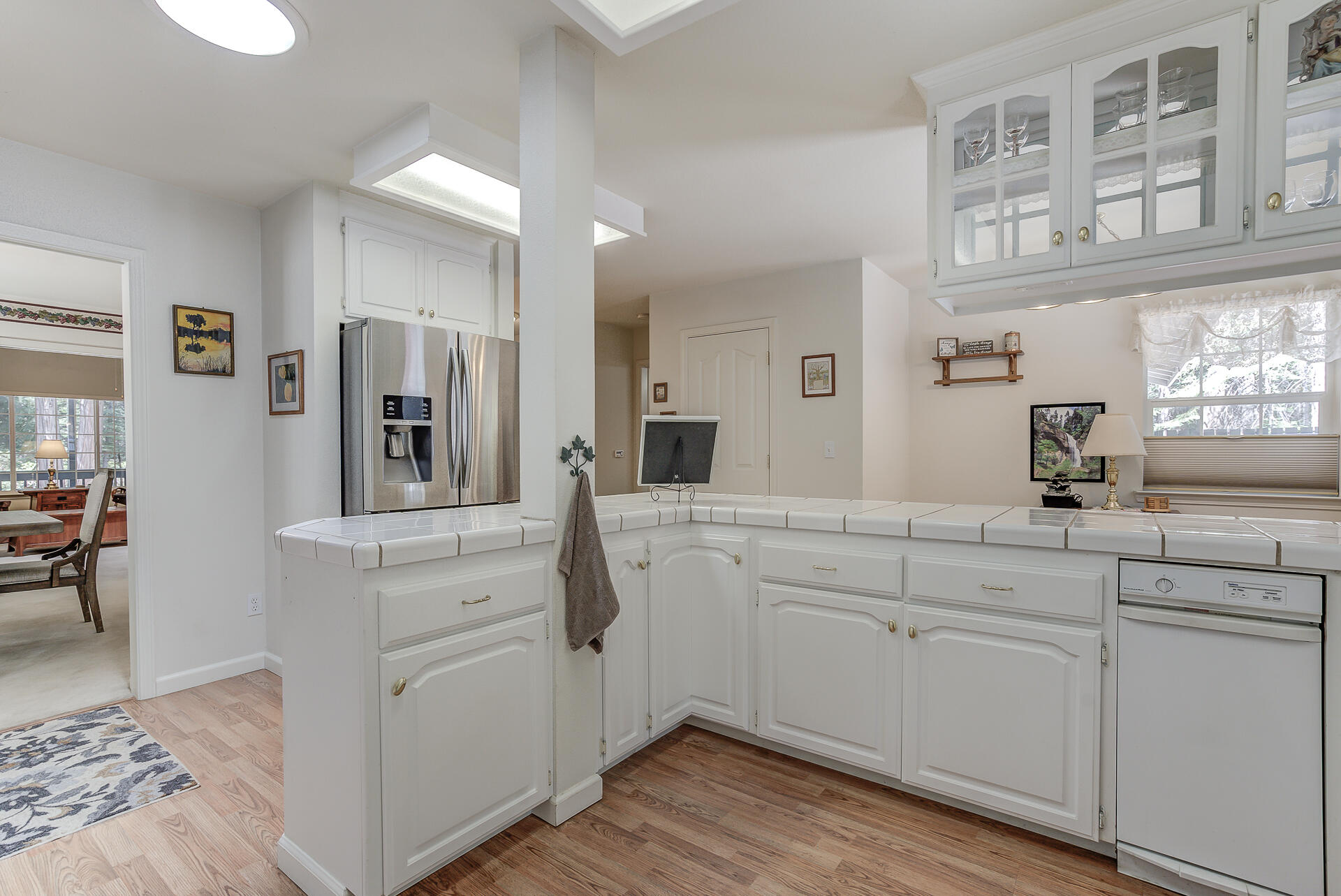 8303 Amberwoods Place Shingletown, CA 96088 - Photo 16 of 58 a spacious bathroom with a sink and a mirror