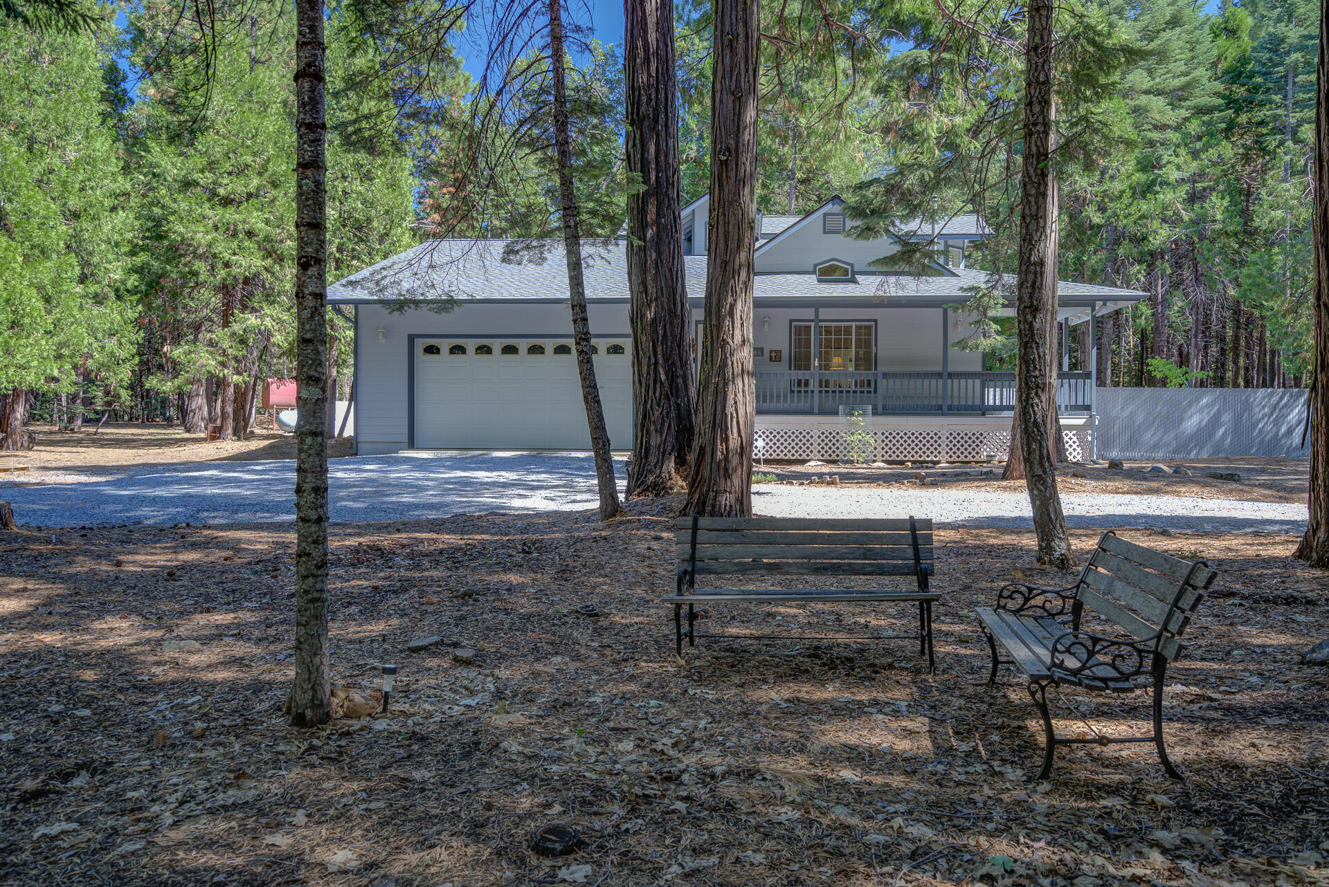 8303 Amberwoods Place Shingletown, CA 96088 - Photo 2 of 58 a view of a house with backyard and a tree