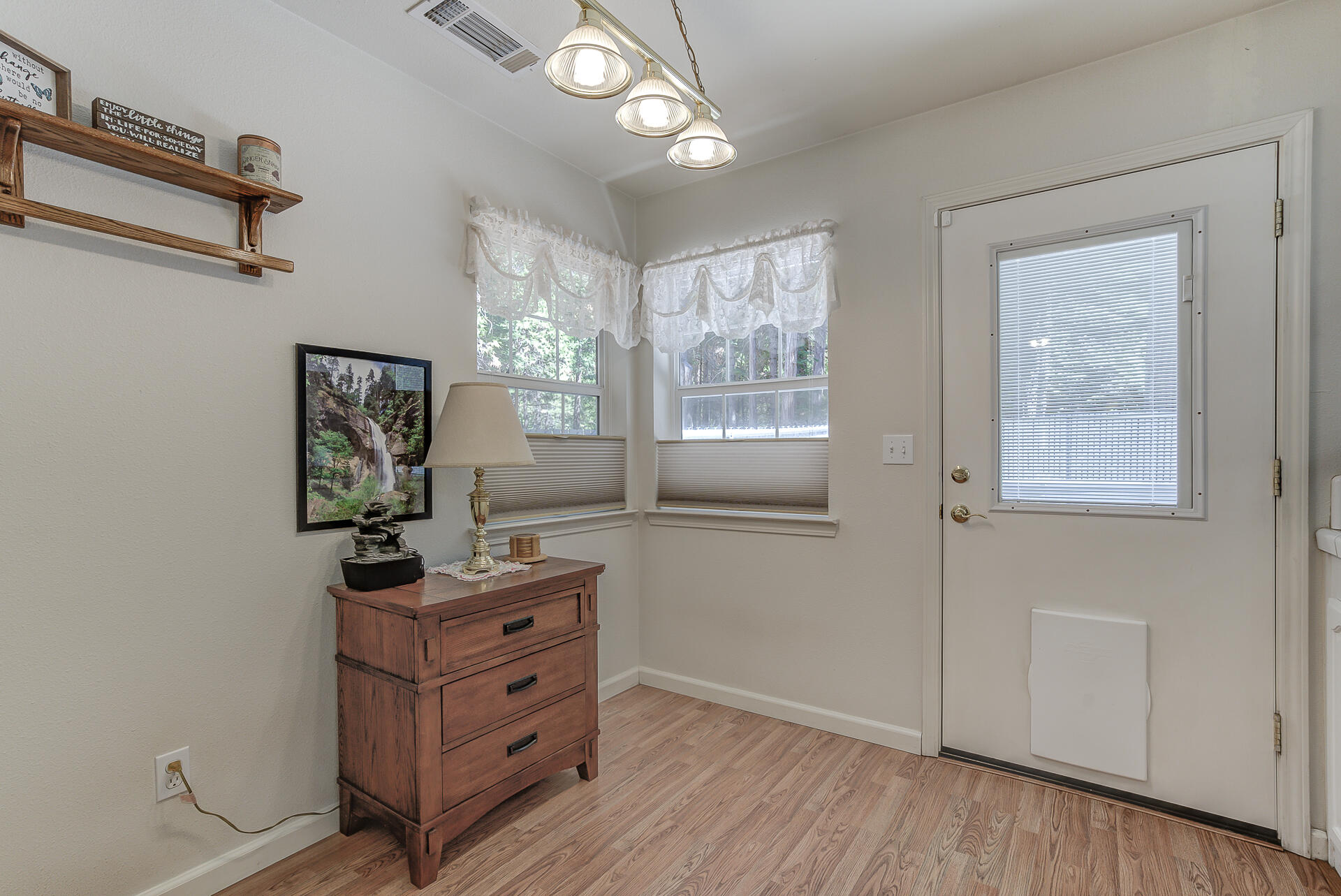 8303 Amberwoods Place Shingletown, CA 96088 - Photo 23 of 58 a view of a workspace with wooden floor and windows